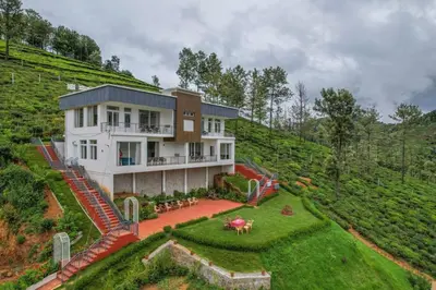 a house on top of a hill with a yard at Heavenly Hills 4 BHK Villa - 1 Bedroom in Kotagiri