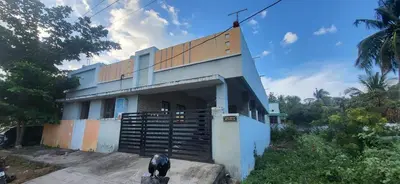 a house with a dog standing in front of it at Serene Steps in Coimbatore
