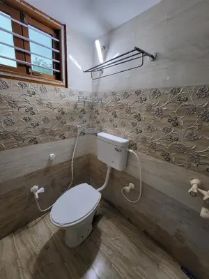 a bathroom with a toilet in a room at Serene Steps in Coimbatore