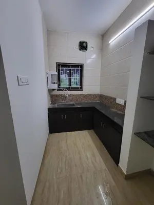 a kitchen with a sink and a counter at Serene Steps in Coimbatore