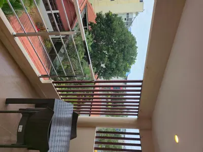 a staircase in a building with a window at Suraksha Suites in Mysore