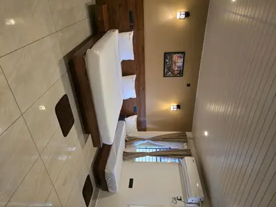 an overhead view of a bathroom with folded towels at Suraksha Suites in Mysore