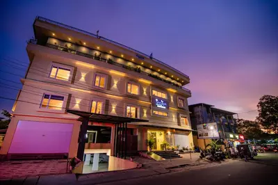 a tall building with lights on top of it at Neelagiri Heritage Hotel in Kozhikode