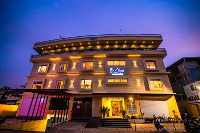 a large building with lights on top of it at Neelagiri Heritage Hotel in Kozhikode