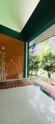 a view from the inside of a building with a window at Tejana villa in Mananthavady
