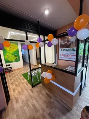 a room with orange and purple balloons hanging from the ceiling at AAN GREENS Rooms And Dormitorys in Vaduvanchal