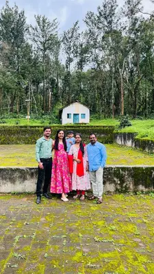 a group of people posing for a picture at Coorg Namana homestay in Suntikoppa