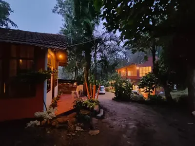 a view of a house at night at Tribal land homestay in Kushālnagar