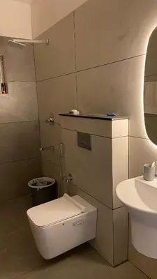 a bathroom with a toilet and a sink at Casa Bella - The Group Stay in Sultan Bathery