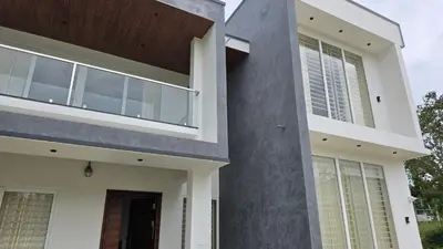 a modern house with white and gray at Casa Bella - The Group Stay in Sultan Bathery