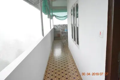 an empty hallway with a floor in a room at Jungle View Homestay Anakulam in Viripara