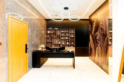 a dressing room with a desk and a shelf at AE Tower Platinum Retreat in Sultan Bathery