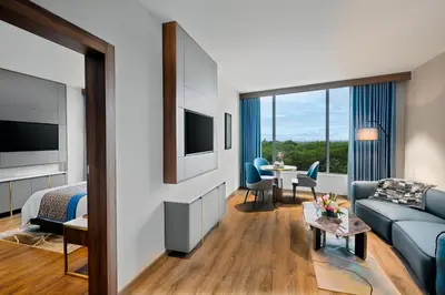 a hotel room with a couch and a living room at Fortune Airport Road Kochi - Member ITC hotels' group in Cochin