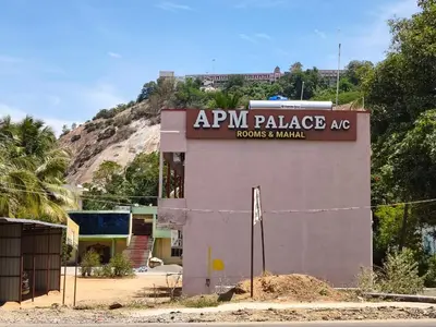a building with a sign that reads aym palace ac rooms and manuals at APM Lodge in Palaiya Ayakkudi
