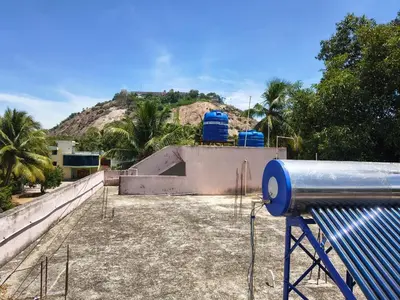 a skate park with a skateboard ramp in front of a mountain at APM Lodge in Palaiya Ayakkudi
