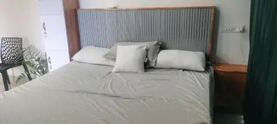 a bed with white pillows on it in a room at Little home Apartment 1 in Tāzhekkod