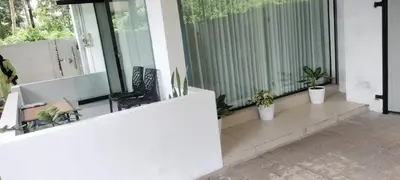 a balcony with potted plants on a house at Little home Apartment 1 in Tāzhekkod