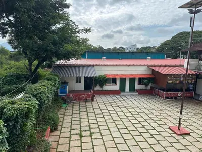 a house with a patio in front of it at Athithi Comforts in Mysore