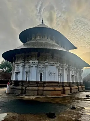 a large white building with a dome on top at Private 1BHK Kerala Village Homestay with Open Veranda near Thrissur in Cheruthuruthi