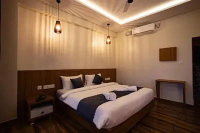 a bedroom with two beds and two lights at Lake Paradise Resort in Padinjarathara