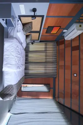 a bedroom with a bed in a room at Misty Slope in Panamaram