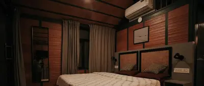 a bedroom with a bed in a room at Misty Slope in Panamaram