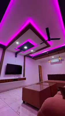 a living room with purple lights on the ceiling at Bougainvillea HillView Retreat in Palakkad