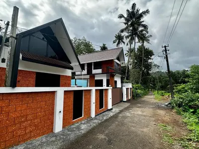 a house with a window on the side of it at Cloud Lacasa in Athirappilly