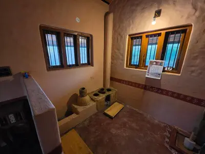 an inside view of a room with a building with windows at Namma Hatti, Traditional Home in Chattanahalli