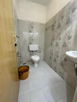 a bathroom with a toilet and a sink at Elim Retreat kanthalloor in Kanthalloor