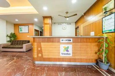 a waiting area in a hospital with a waiting room at Treebo Akshaya Palace Inn in Mysore