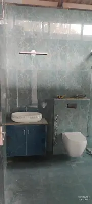 a bathroom with a sink and a bath tub at Tusker villa in Suntikoppa