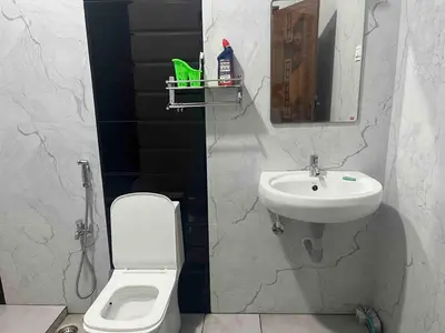 a bathroom with a sink and a toilet at AC 3BHK Full House Kitchen strong WiFi Pollachi in Pollāchi