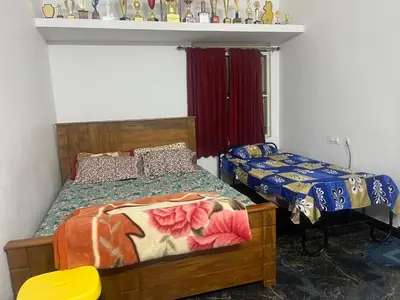 a bedroom with two beds and a window at AC 3BHK Full House Kitchen strong WiFi Pollachi in Pollāchi