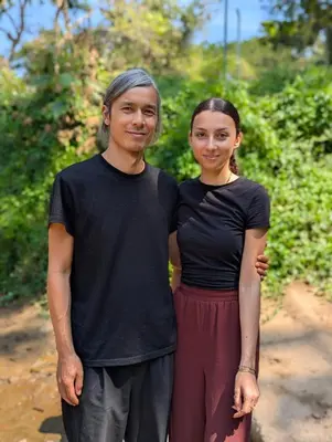 a man and a woman standing next to each other at Ganesha Homestay, Cochin, Near Paniyeli Poru Waterfalls in Malayāttūr