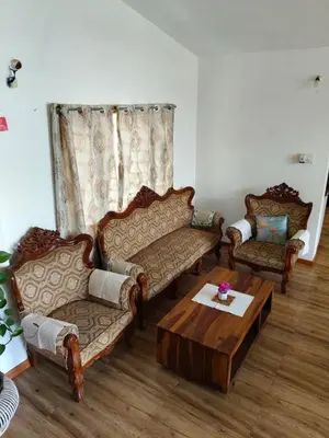 a living room with two couches and a coffee table at Ken valley homes & villa in Lovedale