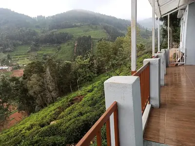 a balcony of a house with a view of a mountain at Ken valley homes & villa in Lovedale