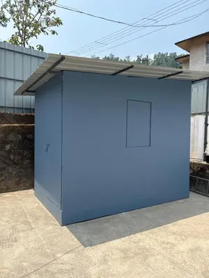 a large blue garage with a roof on top at Fog view cottage - Homestay with food and internet in Vythiri