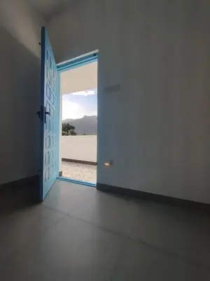 an open door to a room with a view at 3BHK - Villa - a greece style - Kayal vizha - near isha yoga - coimbatore in Coimbatore