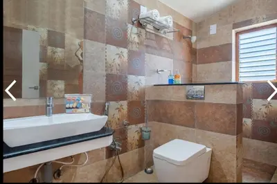 a bathroom with a sink and a toilet at Willostays Cluster Clouds in Ooty