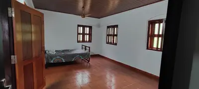 an empty room with a bed in a room at Traditional Kerala house, Kannur-Thalassery in Tellicherry
