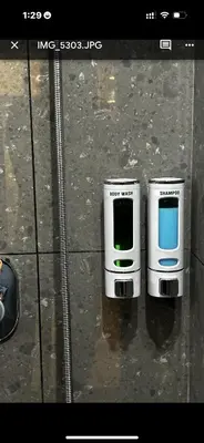 two cell phones are sitting on the ground at Paradise-Vadanappally Beach Villa for 4-5 adults in Irimbranallūr
