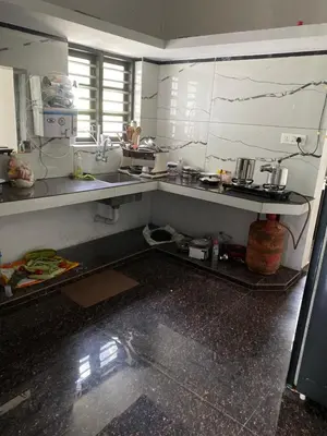 a kitchen with a sink and a counter at Travango Settukunnu in Vythiri