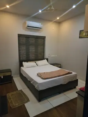 a bedroom with a bed in a room at Havence Villas - Kottakkal in Kottakkal