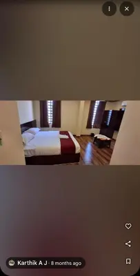 a picture of a bedroom with a bed at Ridhis Stay in Virajpet