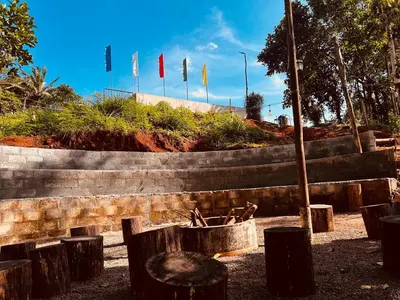 a group of flags in a park with a basket at Bambus Alley in Wayanad
