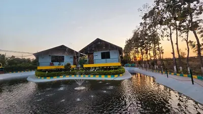 a house in the middle of a body of water at Nature's Spark Resort in Sivasamudram