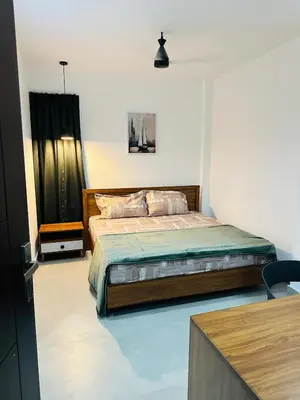 a bedroom with a bed in a room at ZAHIR RESIDENCY calicut in Kozhikode