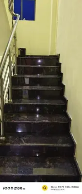 a set of stairs in a building at S M LODGe in Dharmapuri