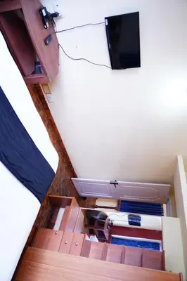 an overhead view of a room with a television on the ceiling at KP Holidays తెలుగు Cottage in Ooty